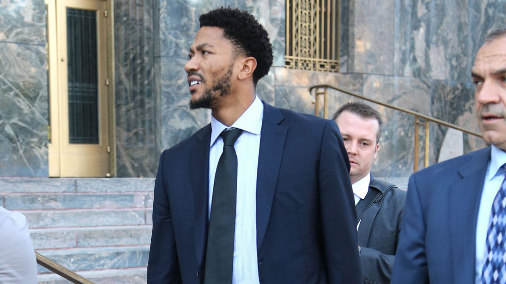 Derrick Rose smiles as he leaves court with his lawyer Mark Baute on Tuesday October 11th in Downtown Los Angeles.